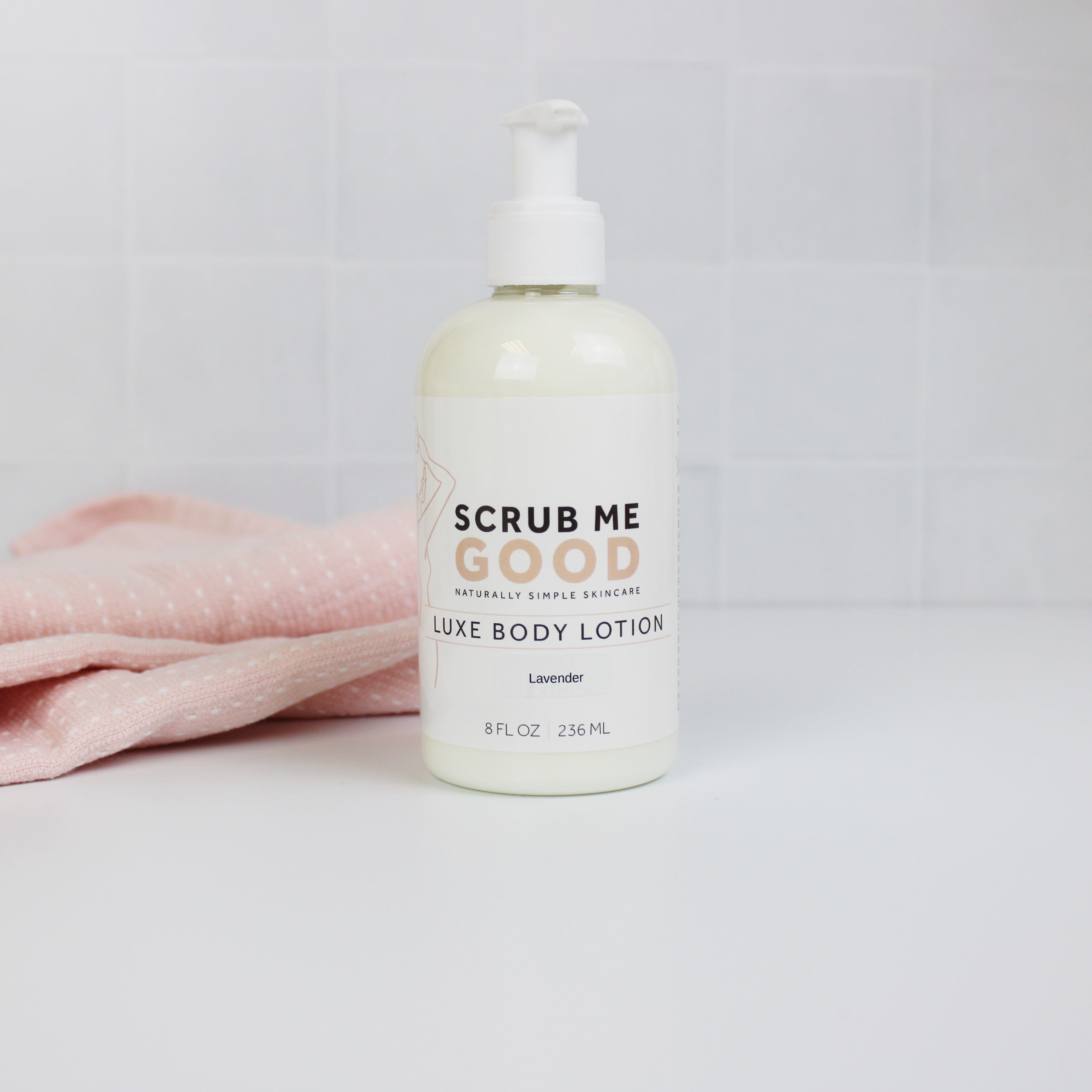 lavender luxe body lotion on white backround with towel