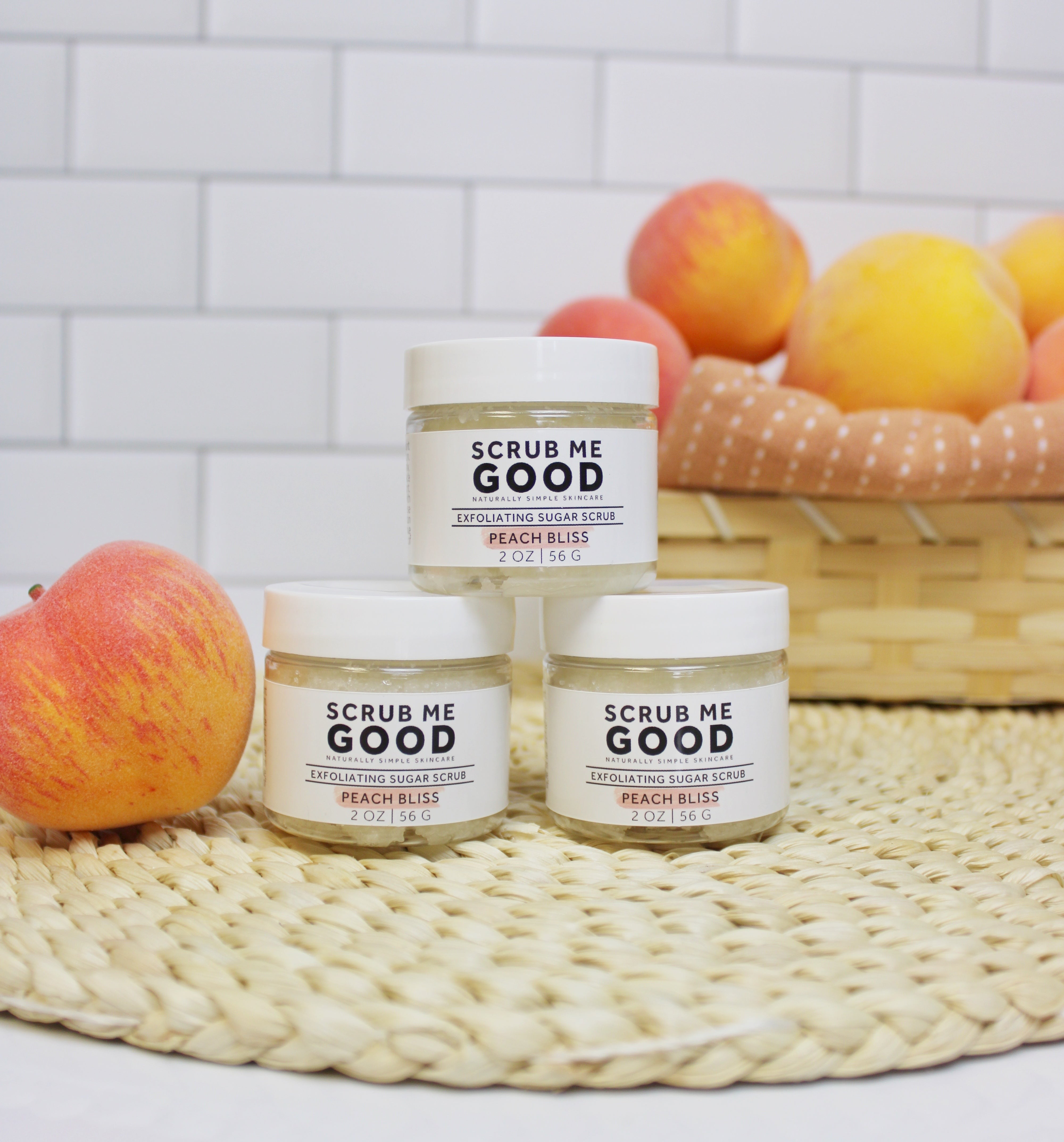 Sweet peach body scrub for dry skin exfoliation stacked in a pyramid