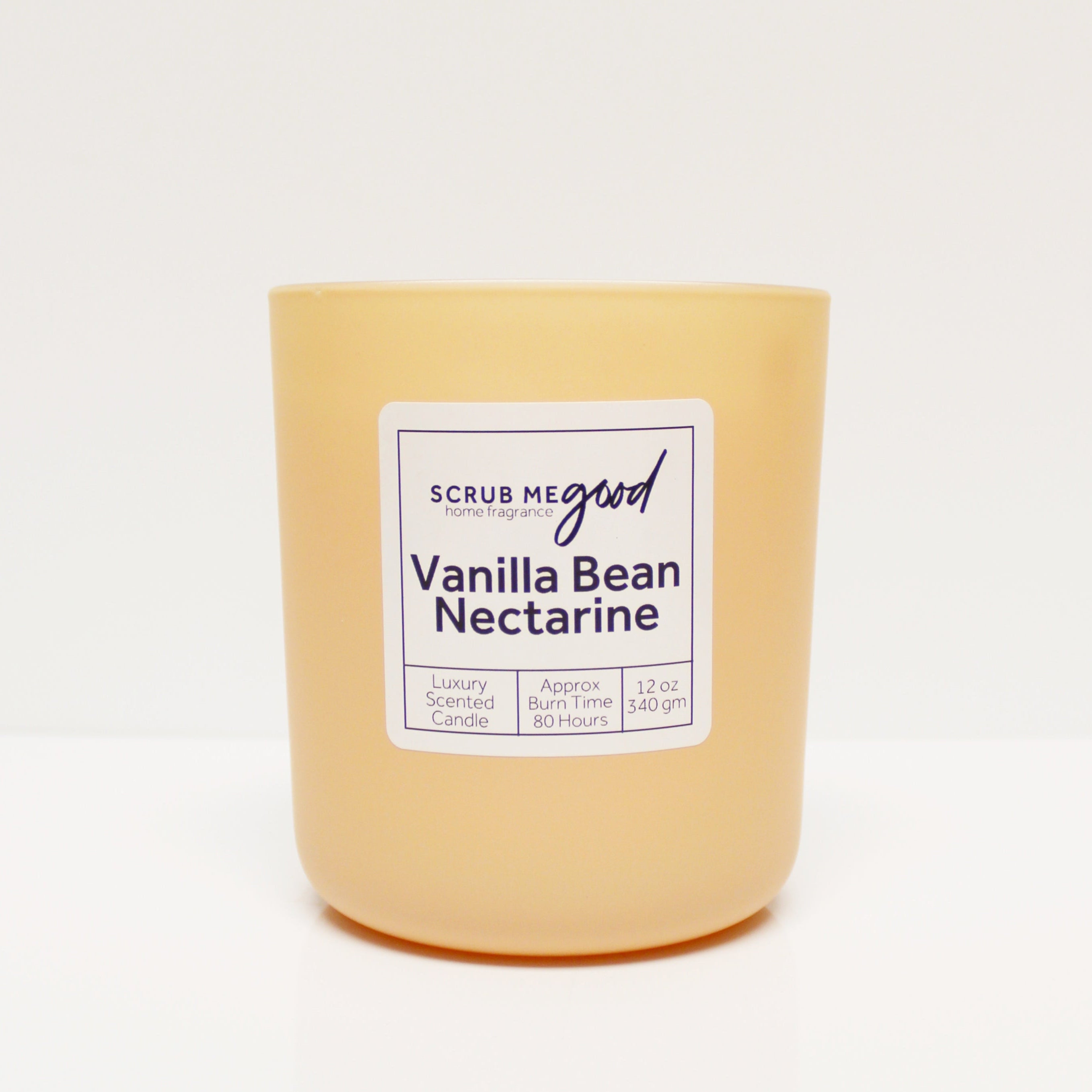 Vanilla Bean Nectarine Scented Candle – 12 oz peach-colored glass jar with wooden wick and notes of nectarine, vanilla, and coconut