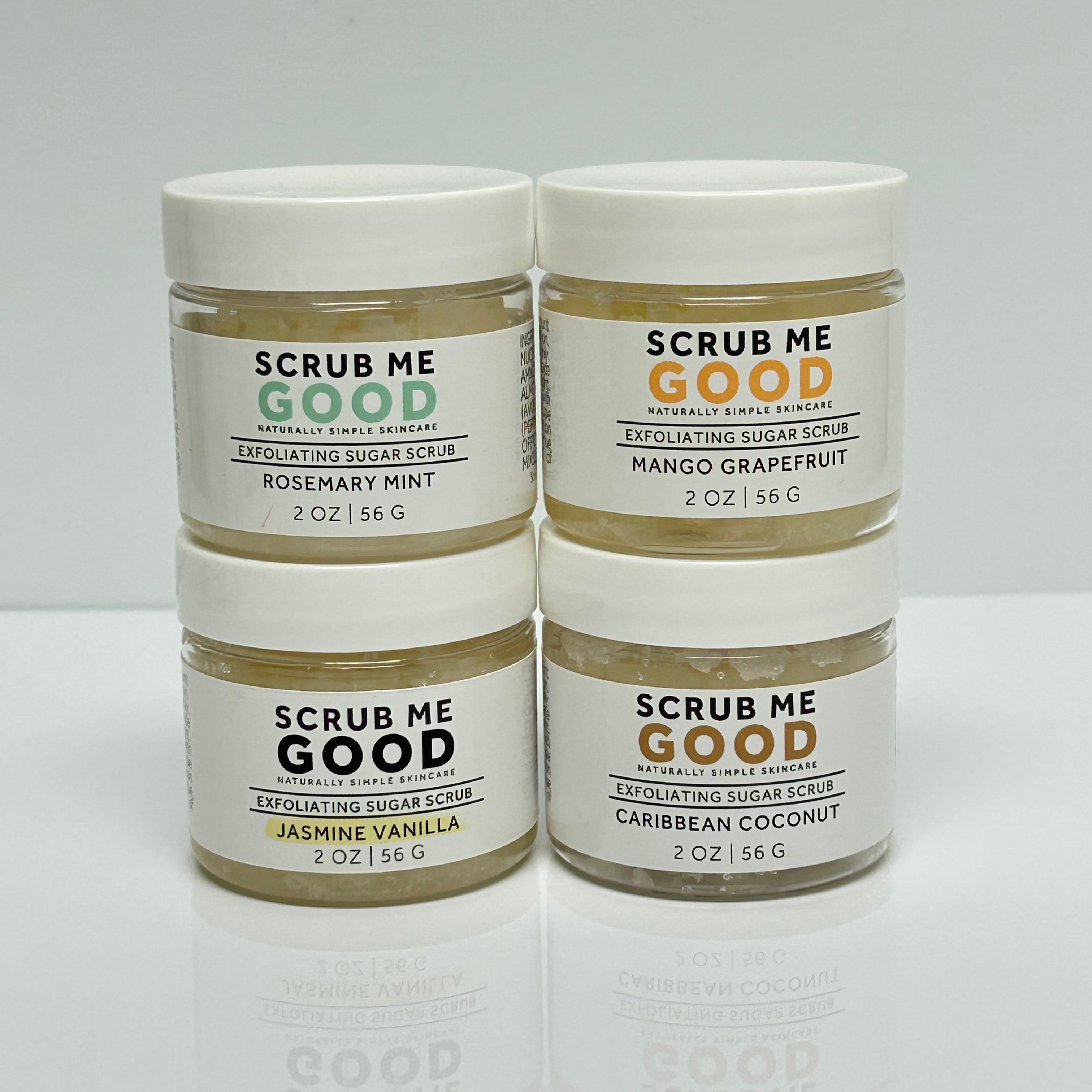 4 Scrub Me Good exfoliating sugar scrub Jars on white backround