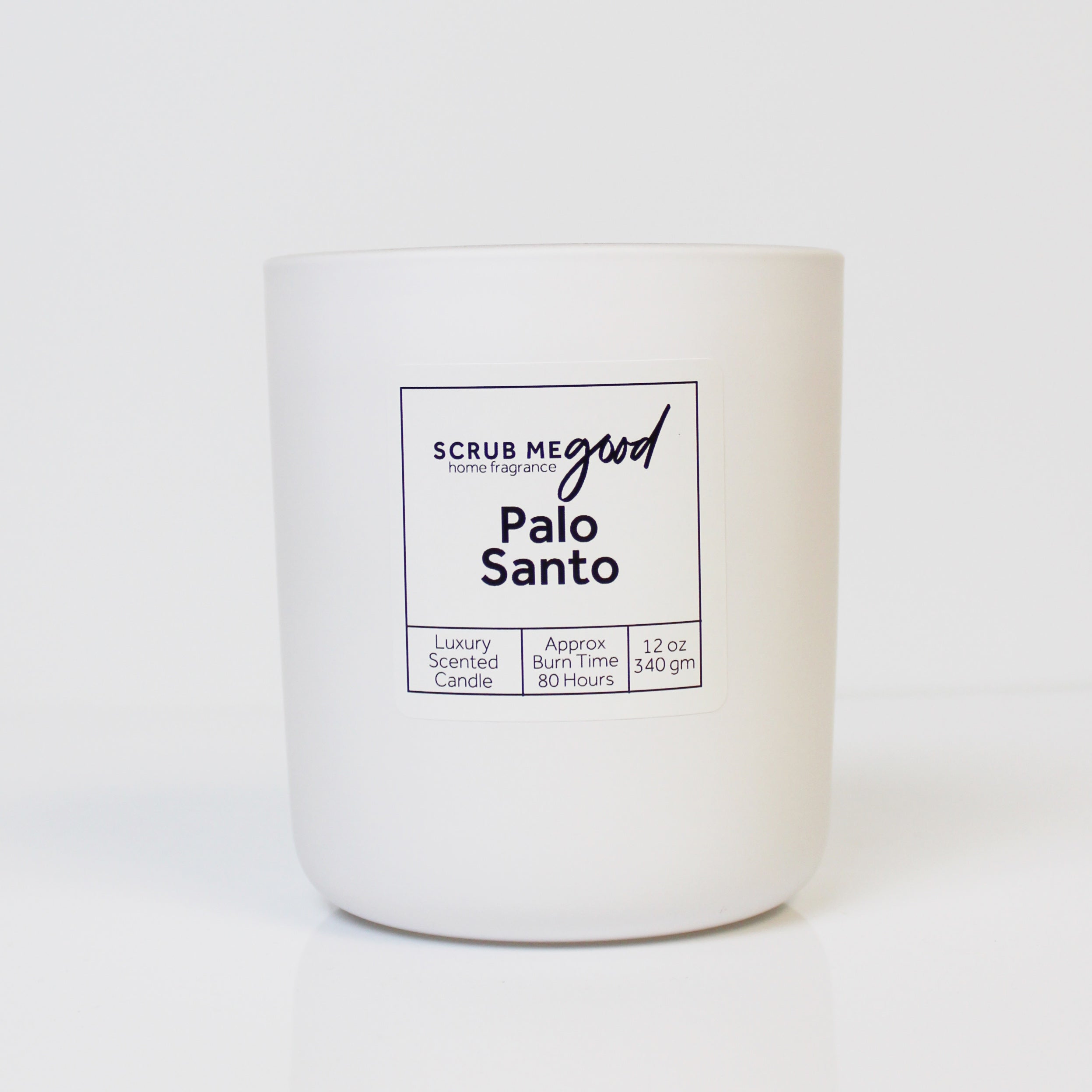 Scrub Me Good Palo Santo 12 oz wooden wick candle featuring earthy wood and soft spice fragrance.