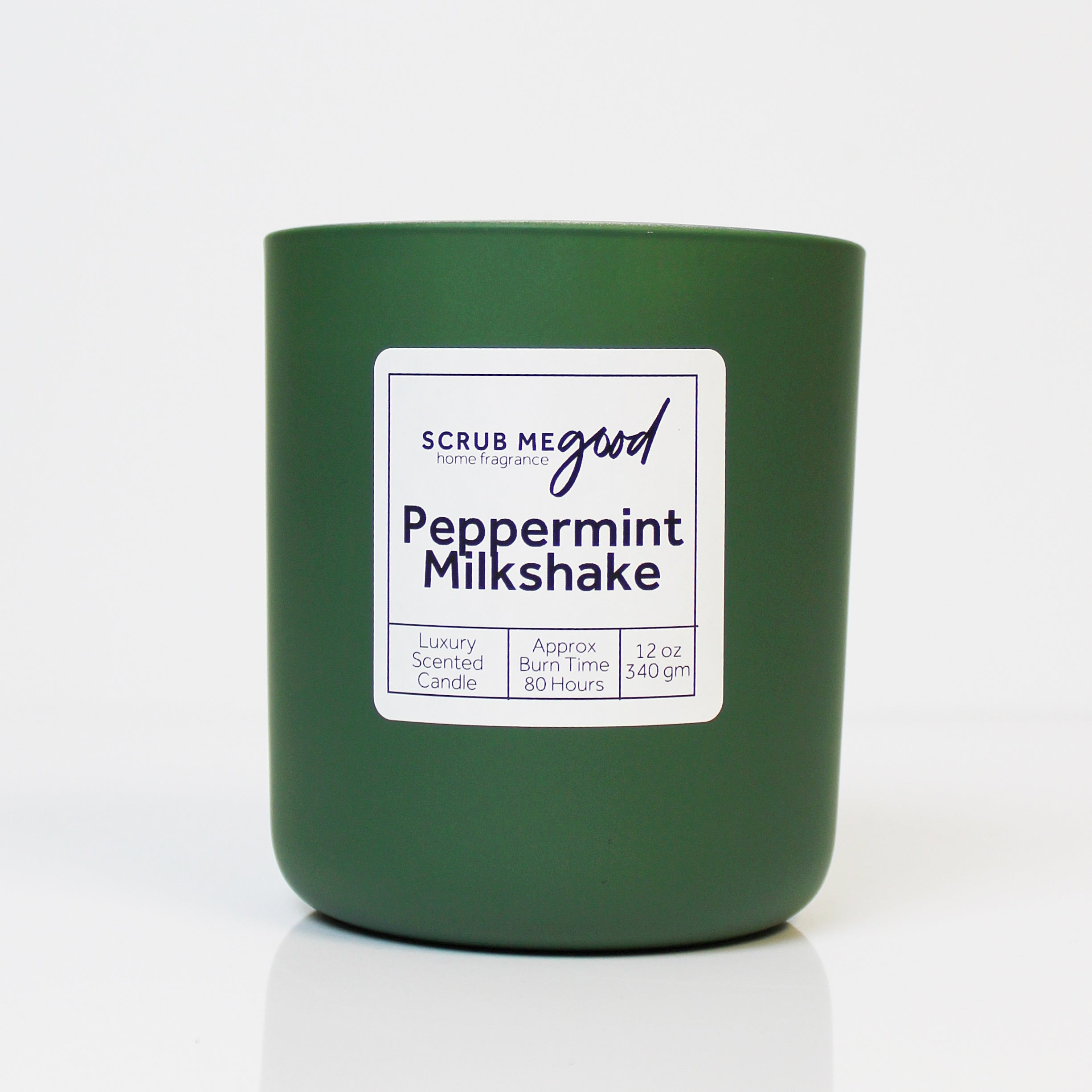 Scrub Me Good Peppermint Milkshake 12 oz wooden wick candle in green jar with creamy mint and vanilla notes.