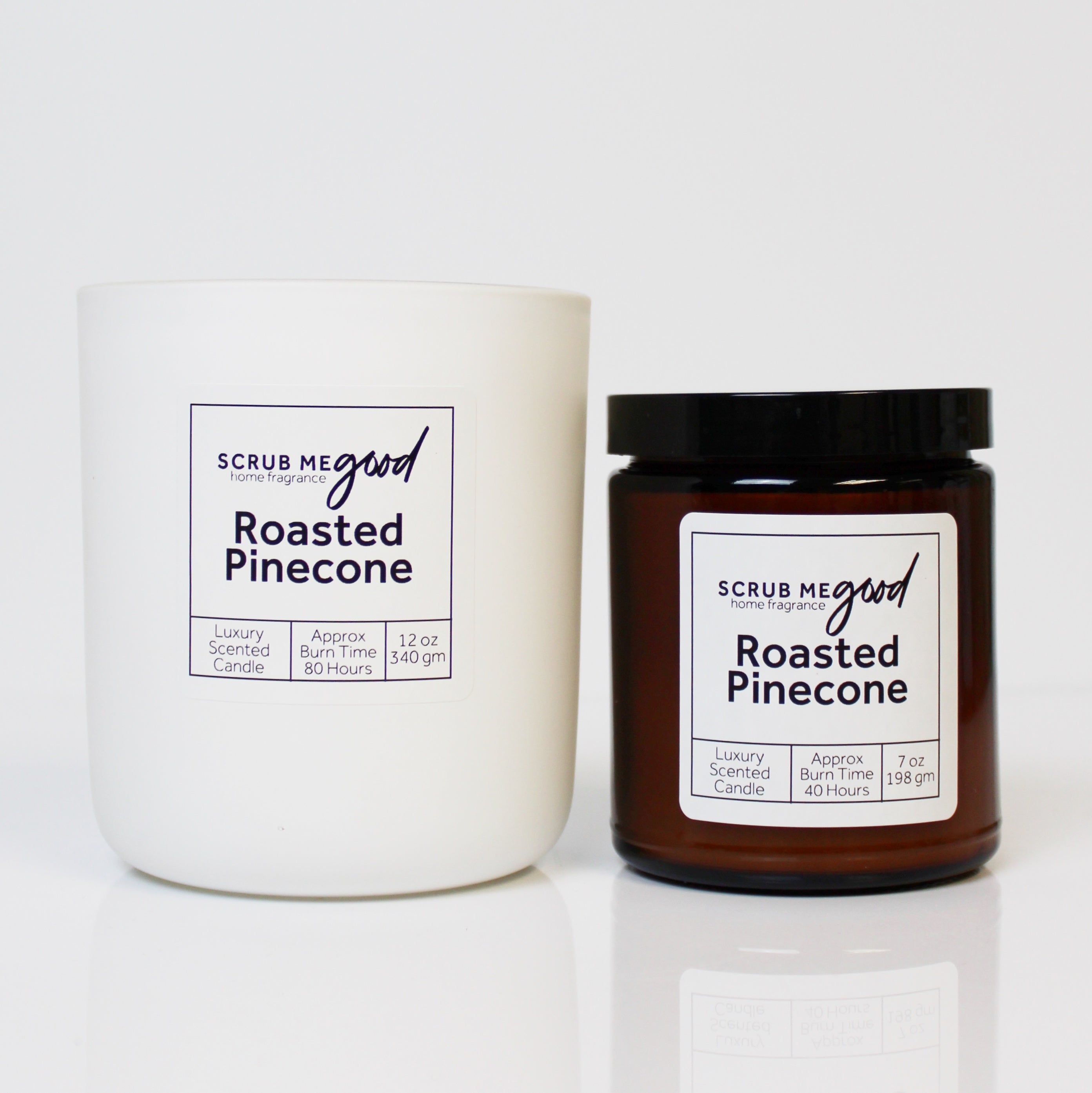Scrub Me Good Roasted Pine Cone wooden wick candles in both sizes styled for the holiday season.