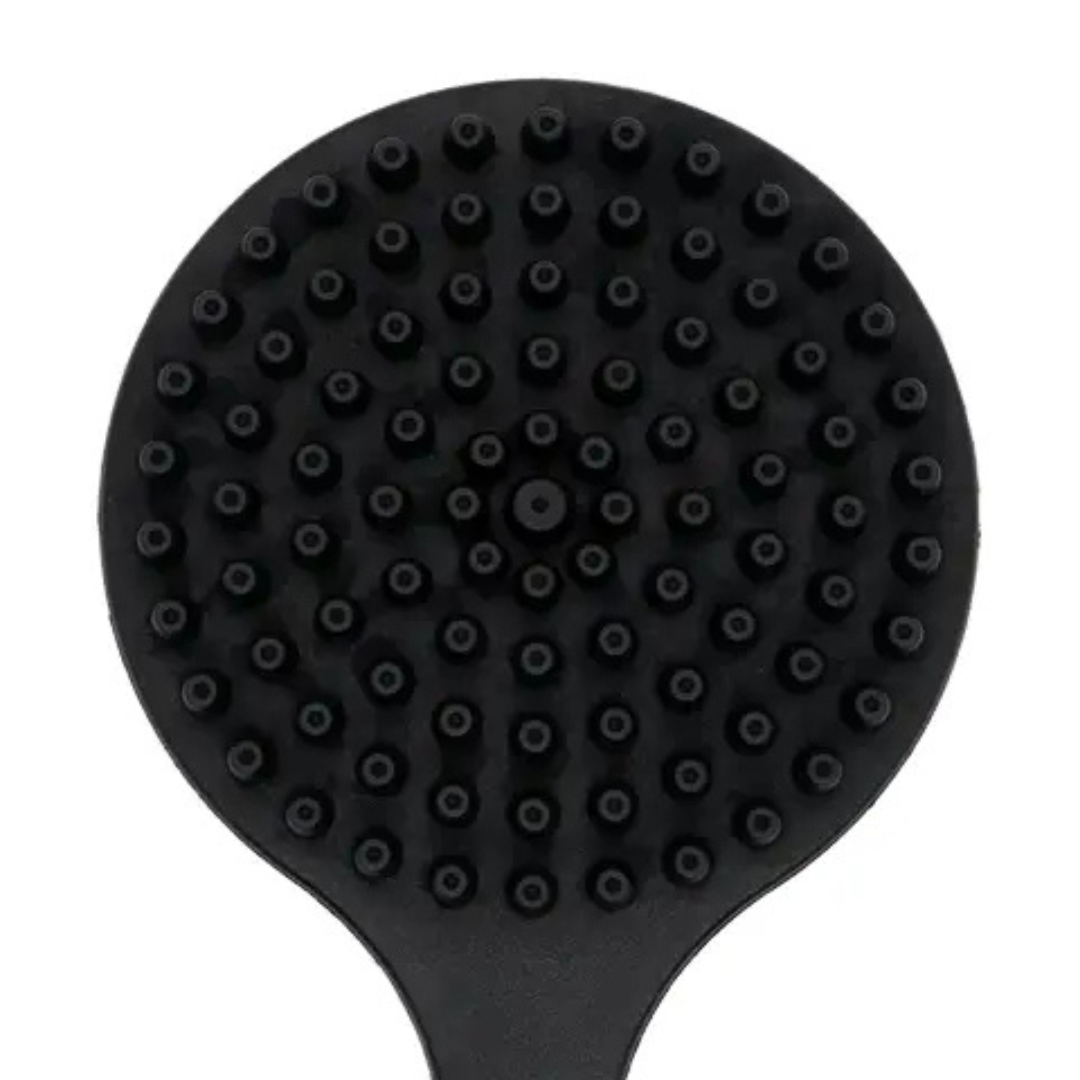 Close-up of black back scrubber brush head with short, rounded bristles