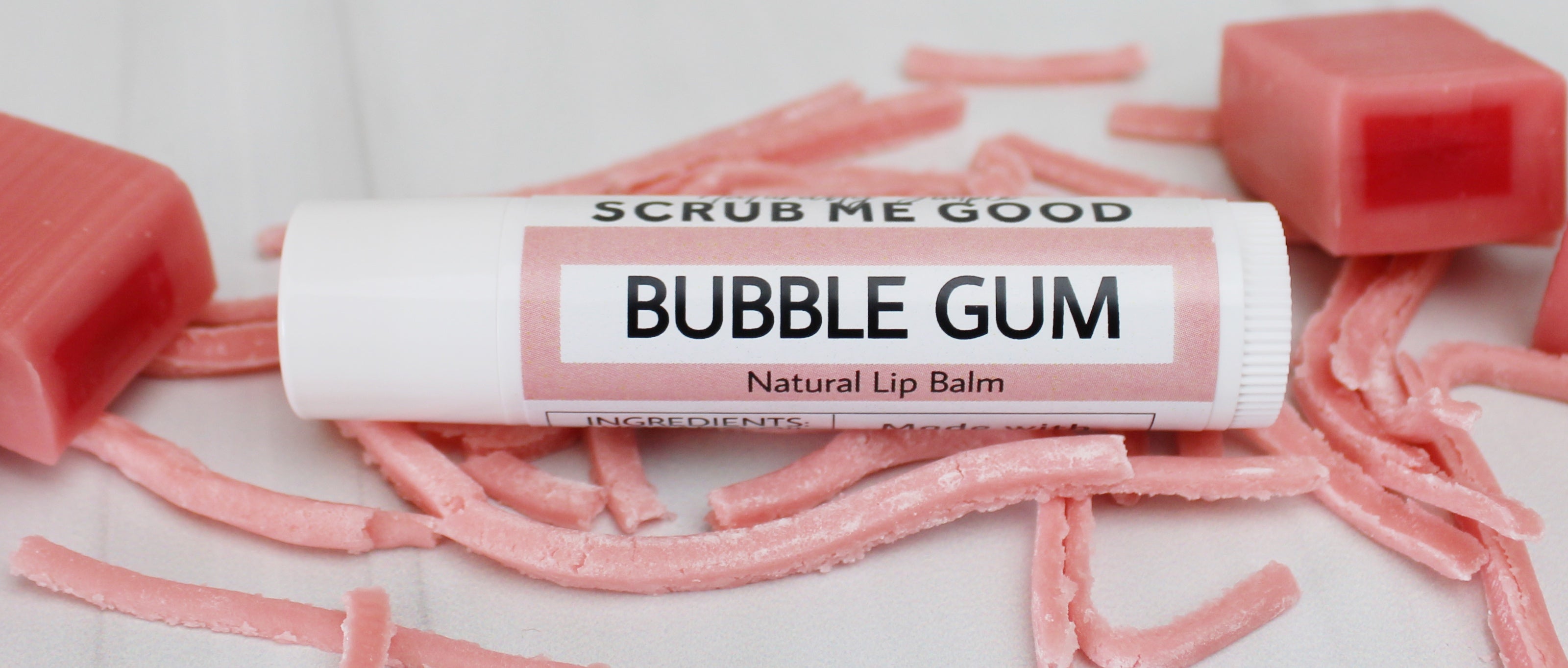 bubble gum lip balm surrounded by bubble gum