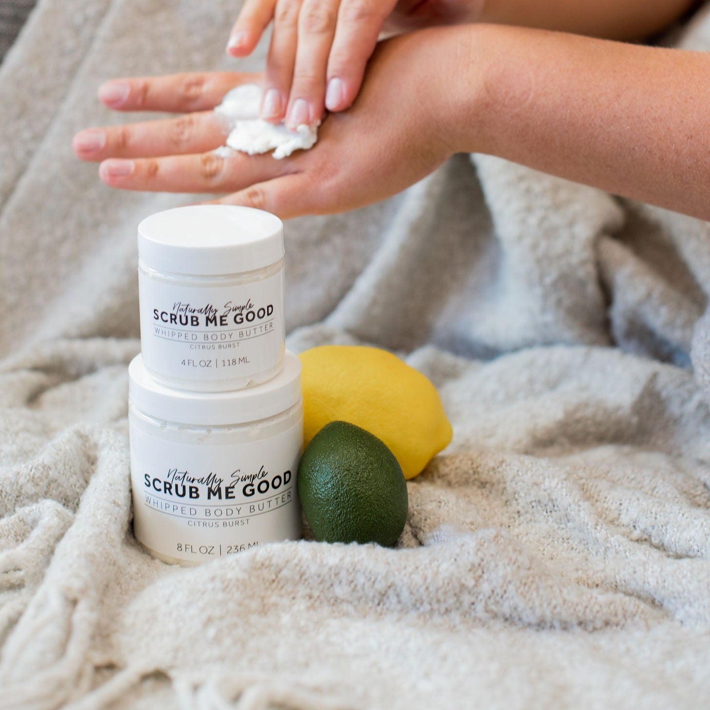 Thick whipped body butter with citrus scent