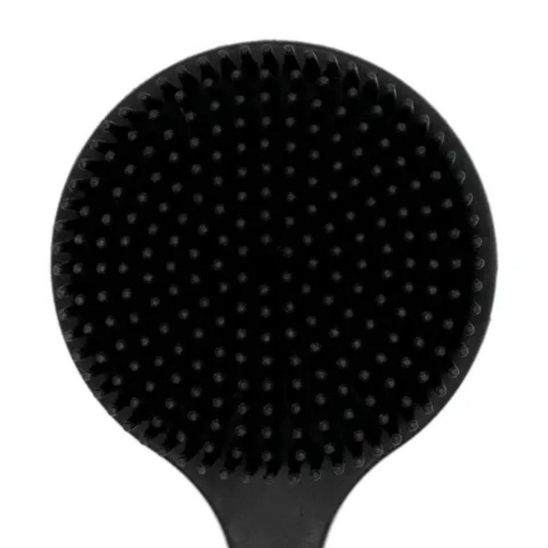 Close-up of back scrubber brush showing dense bristle texture designed for exfoliation