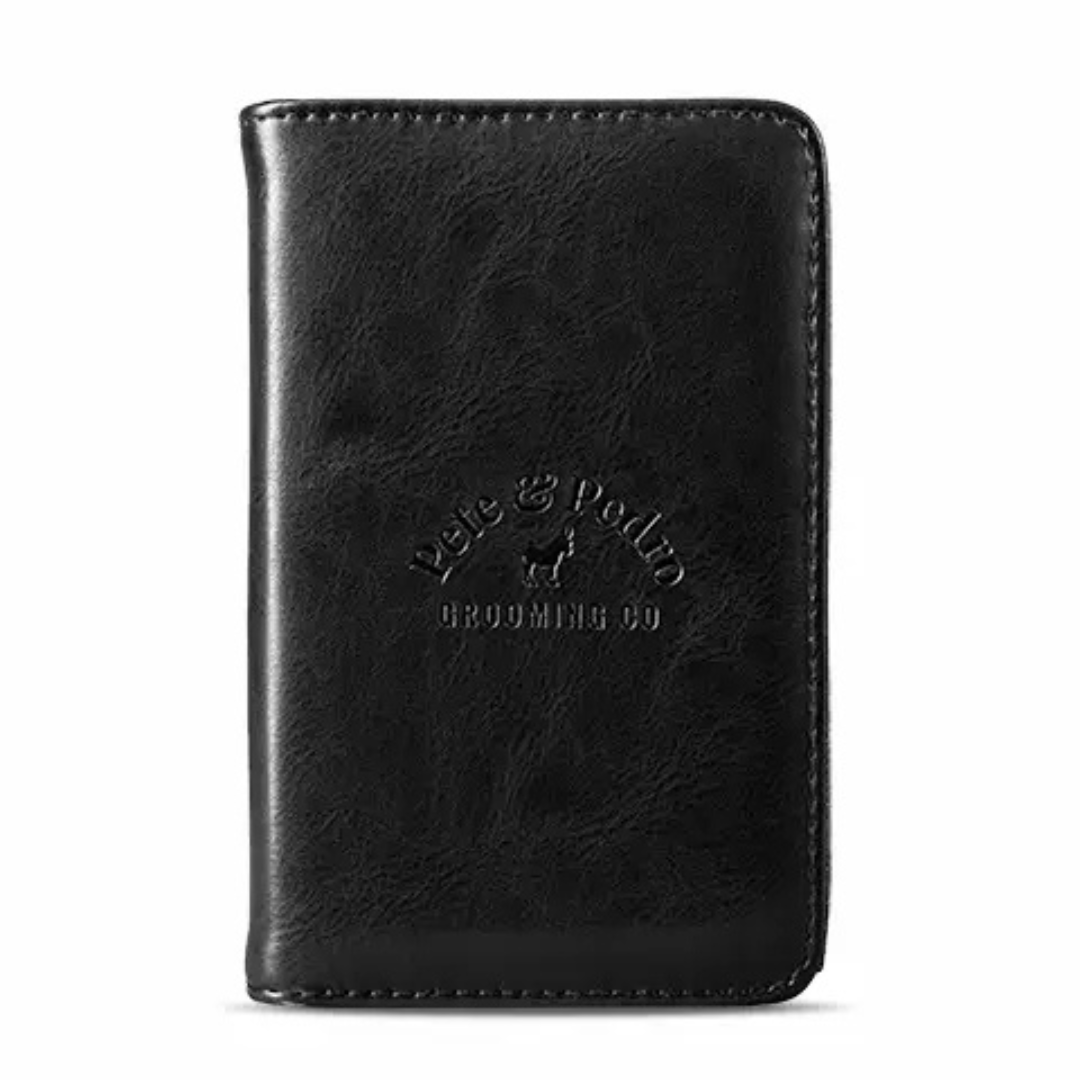 Closed black leather men’s manicure case with embossed logo, compact and travel-ready.
